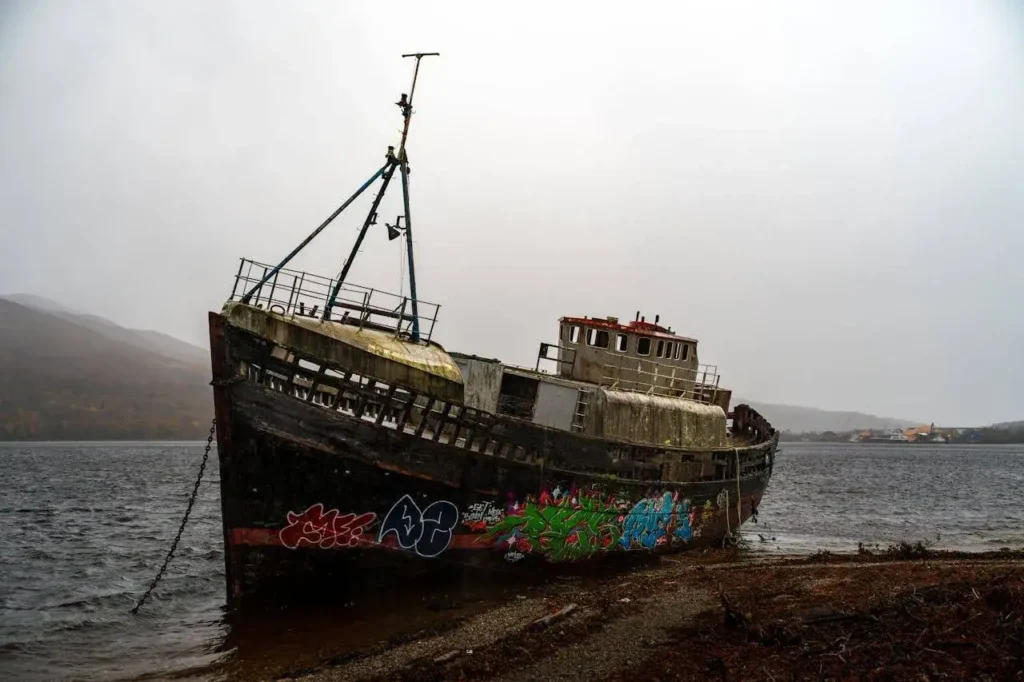 An abandoned ship with graffiti