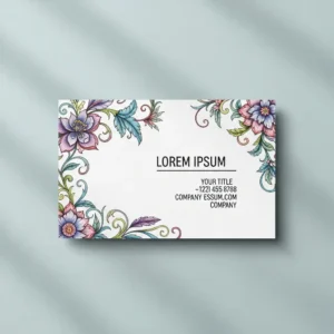a pretty, floral business card with intricate illustrated flowers around the border