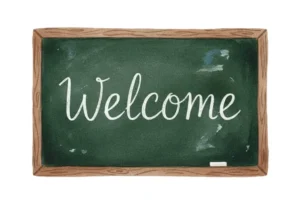 Green chalkboard that says Welcome in white cursive for back to school clipart